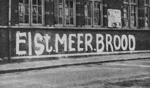 Resistance grafitti in a street in the Netherlands during the Dutch famine of the winter of 1944-45. The slogan reads 'Eist Meer Brood' .