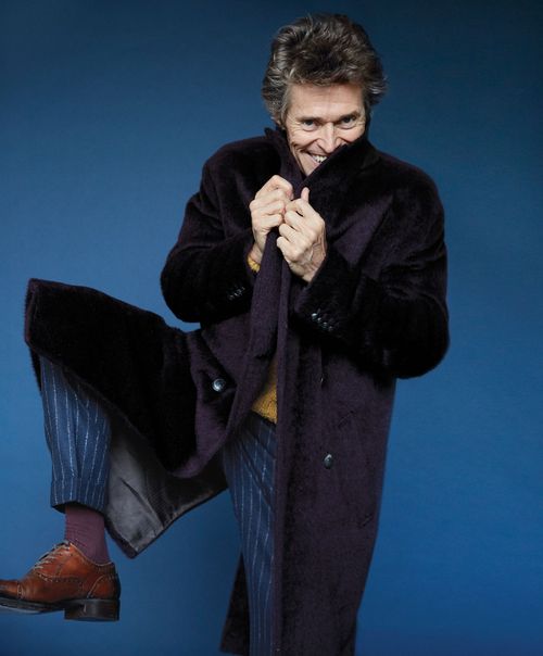 This image may contain Willem Dafoe Clothing Apparel Coat Overcoat Sleeve Human Person and Suit