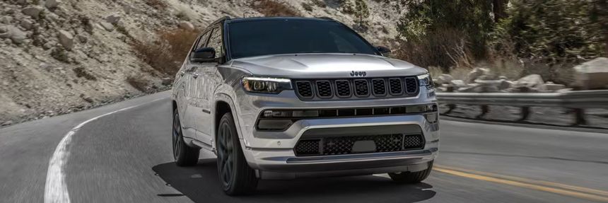 Jeep Compass driving on mountain road demonstrating everyday SUV capability