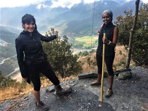 Hikers traversing the dramatic paths of Tiger Leaping Gorge in Yunnan, China
