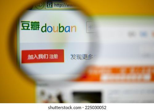 LISBON, PORTUGAL - OCTOBER 21, 2014: Photo of Douban homepage on a monitor screen through a magnifying glass. Editorial Stock Photo