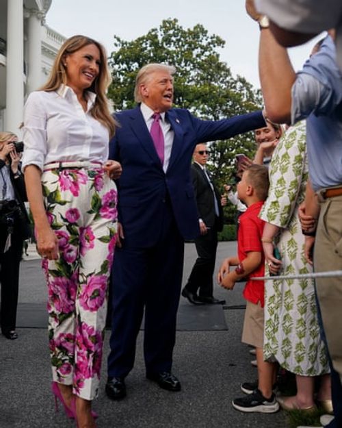 Melania and Donald Trump greet members of the public at the White House