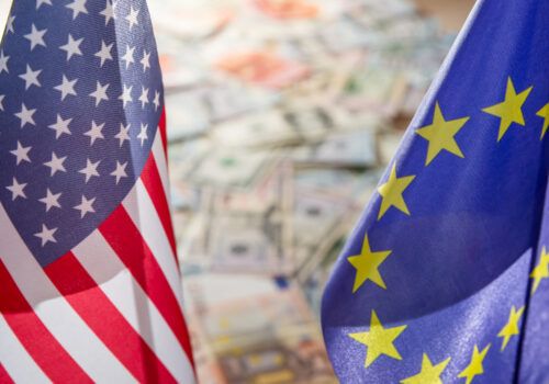 flags of the united states and european union are shown in front of a map