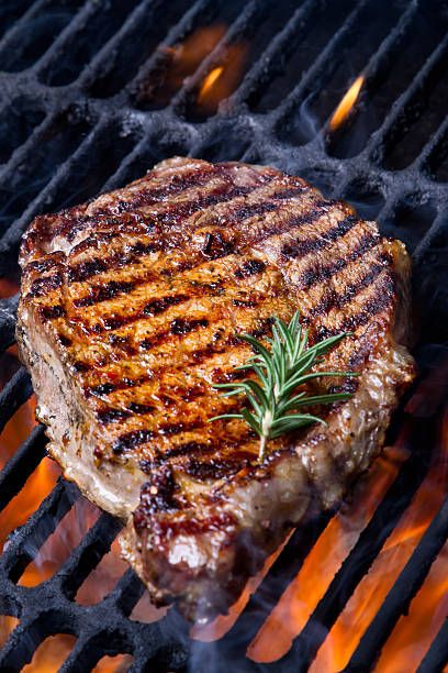 ribeye steak on grill - rib eye steak stock pictures, royalty-free photos & images