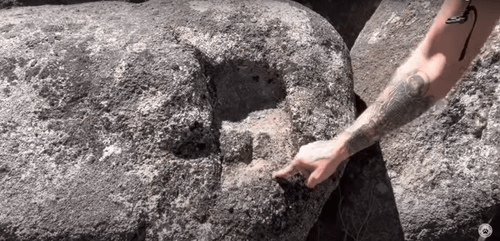 r/AlternativeHistory - Figure 5. Michael examines a peculiar hand-shaped "scoop mark" on a boulder near the Sage Wall.
