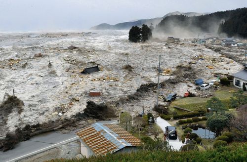 town being wiped out by tsunami