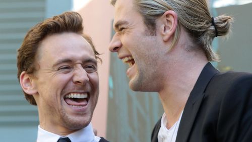 Chris Hemsworth and Tom Hiddleston laughing hard