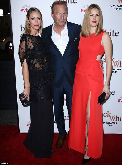 Family man: Kevin Costner was outshone by his glamorous wife Christine Baumgartner (left) and daughter Lily Costner (right) at the Los Angeles premiere of Black Or White on Tuesday