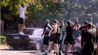 Video: Police cars damaged in Queensland hooning event, two men charged - Drive