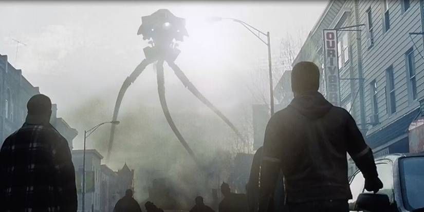 War of the Worlds Tripod towers over a cityscape as Tom Cruise looks on