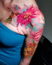 Half arm sleeve of watercolour flowers and a hummingbird