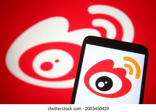 KYIV, UKRAINE - JULY 06, 2021: In this photo illustration Sina Weibo logo of a Chinese microblogging (weibo) website is seen on a mobile phone and a computer screen. Editorial Stock Photo