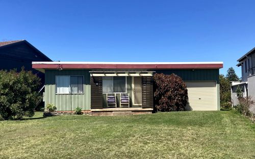 1960s-style beach house in Bawley Point with retro architecture and coastal charm.