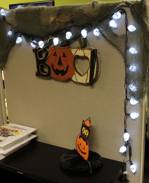 an office cubicle decorated with halloween decorations
