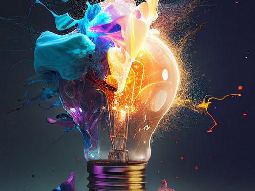 Colorful paint splashes on a light bulb, creating a vibrant and artistic design.