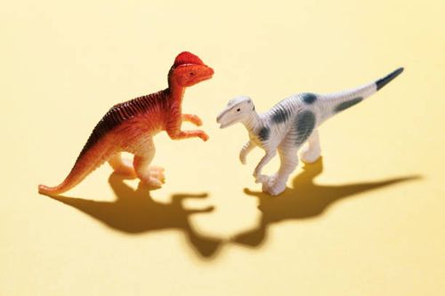 Dinosaur toys Dinosaur toys on yellow background dinosaur fight stock pictures, royalty-free photos & images