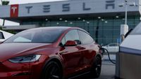 Tesla Profit Slumps as Elon Musk’s Car Company Considers Merging With SpaceX - The New York Times