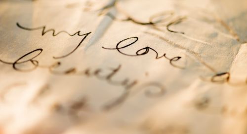 close up of antique love letter on parchment