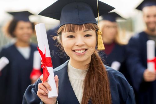 Education, graduation and people concept - close up of happy student in mortar board and bachelor gown with diploma. Bachelor degree stock images, royalty-free photos and pictures
