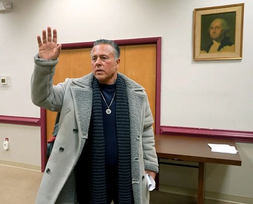 Englishtown Councilman John Alite, a former Gambino crime family hitman, waves as he leaves the Wednesday, April 10, 2025, meeting at the Municipal Building.