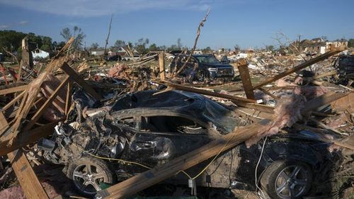 a close up of a car in a pile of debris