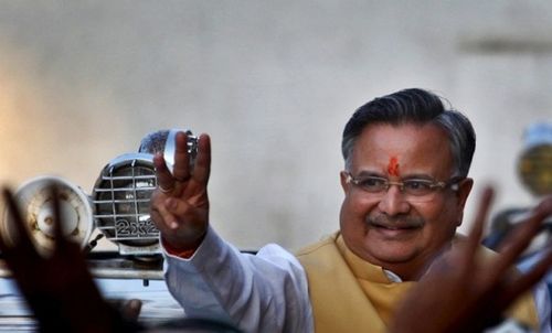 Raman Singh gestures after his third victory in the 2013 Chhattisgarh Legislative Assembly polls, outside the state's BJP party office in the capital city of Raipur.