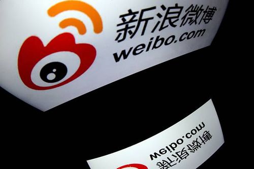 The chinese app Weibo's logo is displayed on a tablet on January 2, 2014 in Paris. AFP PHOTO / LIONEL BONAVENTURE