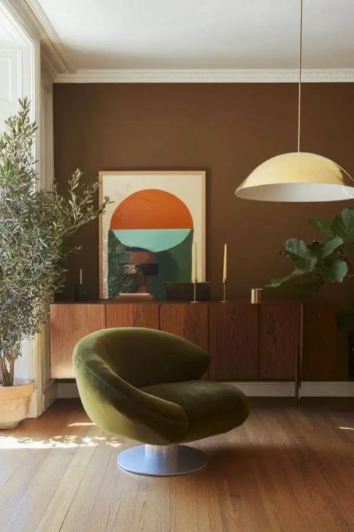 Olive Swivel Chair complements vibrant modern 70s living room aesthetics beautifully.