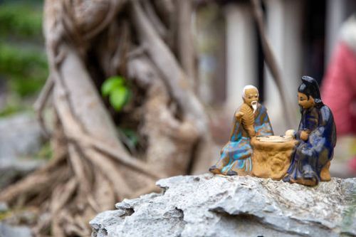 Vietnamese Figurines playing a game Vietnamese Figurines playing a game with copy space vietnamese statues for sale stock pictures, royalty-free photos & images