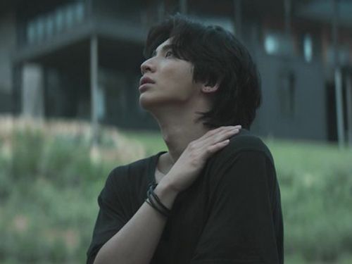 Wang gives himself a hug.