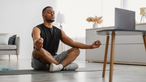 a man meditates after doing yoga, Unlock Your Athletic Potential: Optimize Sleep for Enhanced Performance