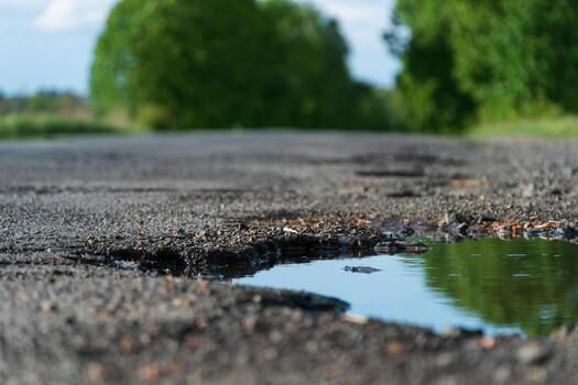 A pothole in the middle of a road photo