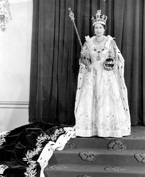 queen elizabeth ii wearing her coronation robes and regalia