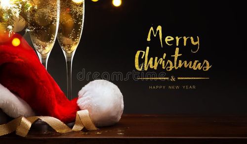 Art merry Christmas and happy New year; champagne and Santa hat. Merry christmas stock images, royalty-free photos and pictures