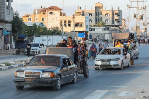 Palestinians flee Bureij after Israeli evacuation order, in the central Gaza Strip