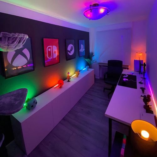 Small and simple game room featuring colorful LED lights and gaming decor for an immersive gaming cave experience.