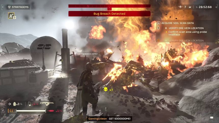 A helldiver uses a flamethrower on alien bugs