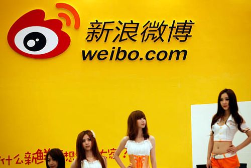 Models pose at the Sina Weibo booth at the ChinaJoy Expo, also know as the China Digital Entertainment Expo and Conference, in Shanghai, China on 29...