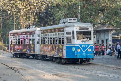 The heritage of Kolkata, trams waiting for passengers at a tram station in Kolkata Kolkata, West Bengal, India - March 11, 2018 : The heritage of Kolkata, trams waiting for passengers at a tram station in Kolkata, India kolkata-tram stock pictures, royalty-free photos & images