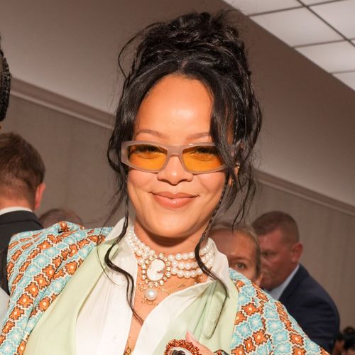 Rihanna rocks school-girl chic in rare public appearance with two-year-old son