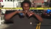 Brazen Minneapolis man flashes gang signals during live news broadcast of mass shooting bloodbath | Daily Mail Online