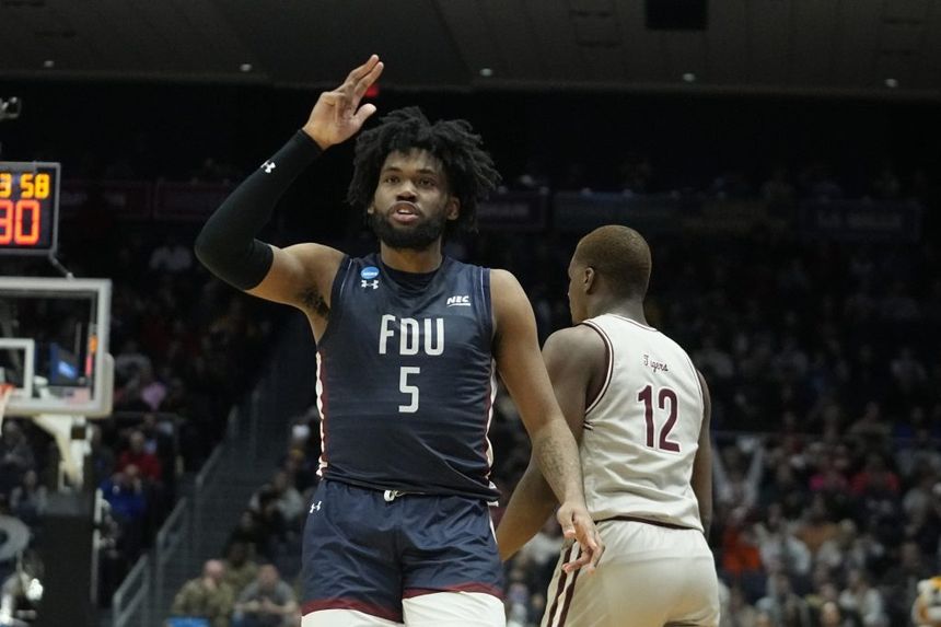 Fairleigh Dickinson's Ansley Almonor (5) celebrates after hitting a 3-point shot against Texas Southern during a First Four college basketball game in the NCAA men's basketball tournament, Wednesday, March 15, 2023.