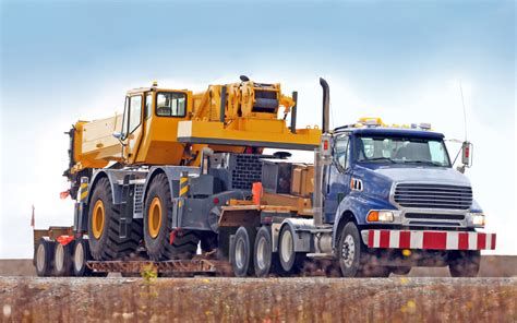 Heavy transport relies on precise route surveying and load securement. Using specialized equipment like RGN trailers ensures the safe movement of over-dimensional machinery.
