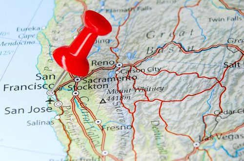 Pinpointed location of a city, country on a map. Red pushpin highlighting a location. Pinpointed location of a city, country on a map. Red pushpin highlighting a location.