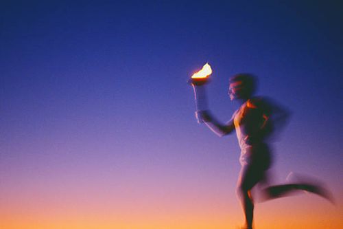 man running with torch at sunset (defocused) - flaming torch stock pictures, royalty-free photos & images