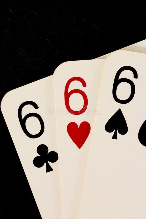 Macro image of three six cards over black background. 666 stock images, royalty-free photos and pictures