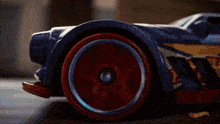 a close up of a hot wheels car on the ground
