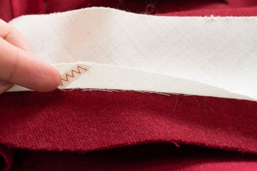 Close-up of hand-stitching on a garment seam