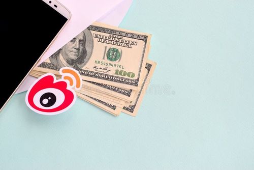 NY, USA - DECEMBER 26, 2019: Weibo paper logo lies with envelope full of dollar bills and smartphone. Weibo app stock images, royalty-free photos and pictures