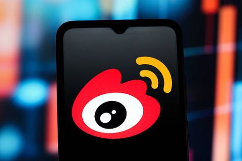 In this photo illustration, the Sina Weibo logo is seen displayed on a smartphone screen.